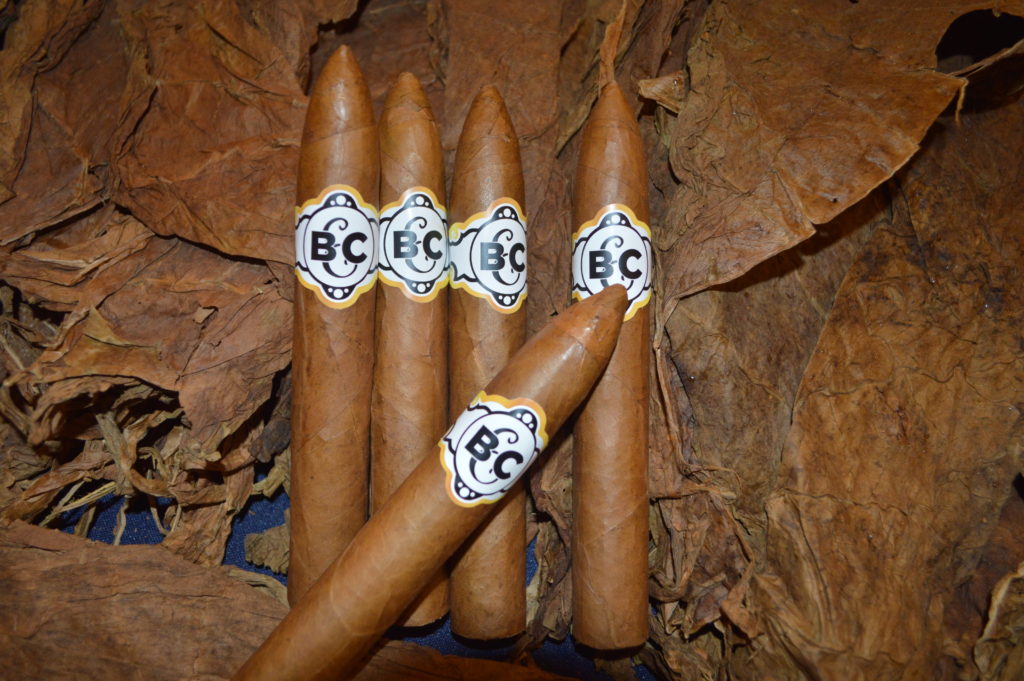 Cuban style hand rolled cigars with custom logo.